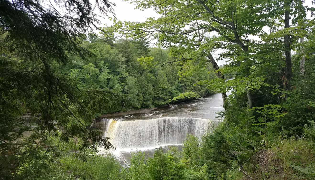 Second Picture of Upper Falls Through Trees From Path Second Picture of Upper Falls Through Trees From Path