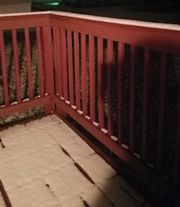 back porch, right corner with some snow on railing